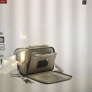 Tumi crossbody purse